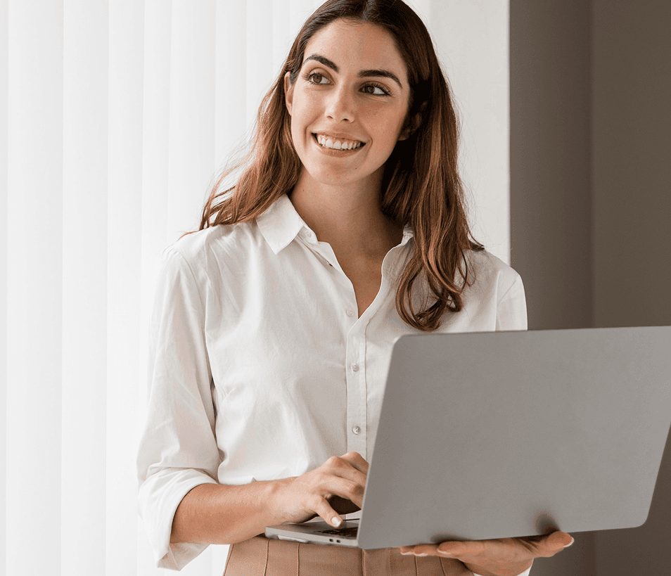 Woman walking with laptop