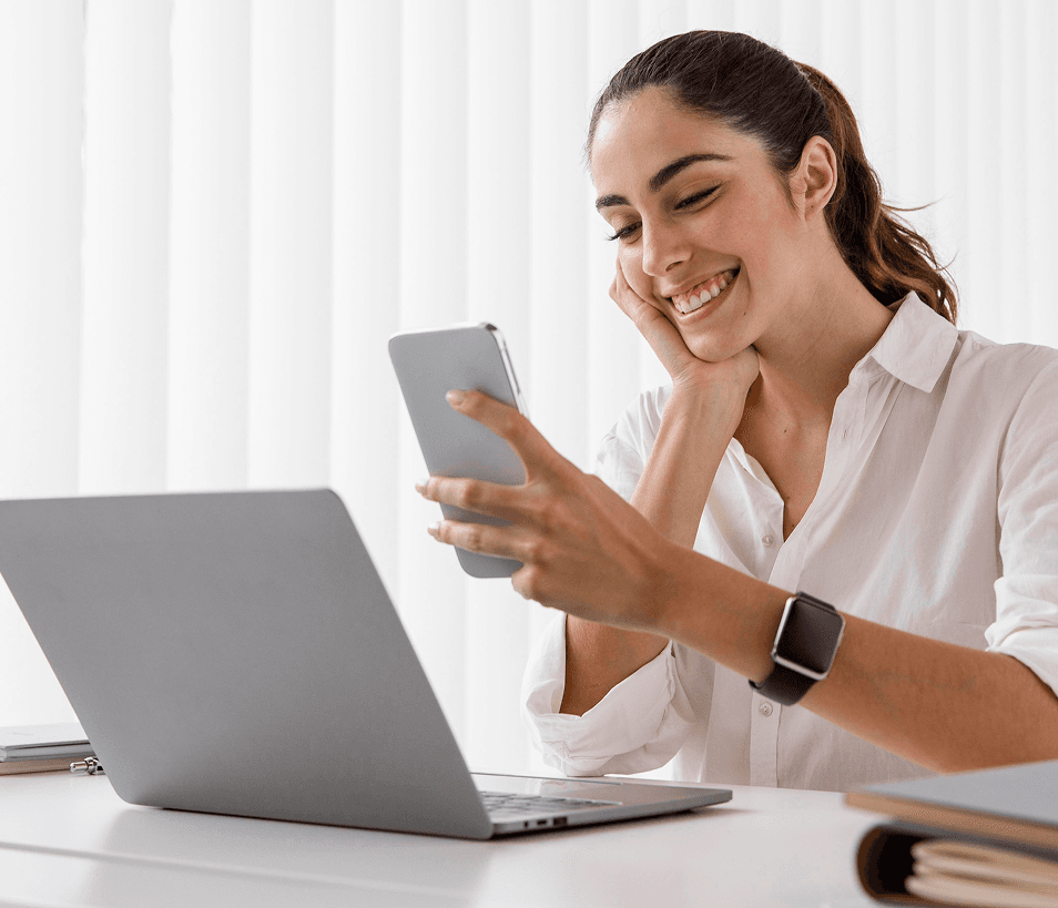 Woman smiling at phone